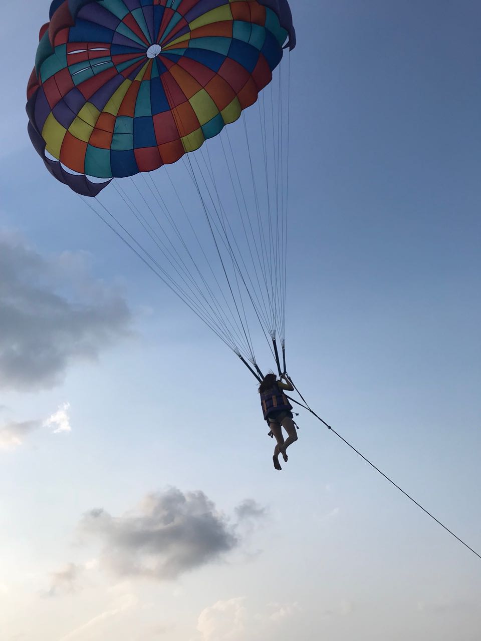 a picture of a person paragliding surfing
